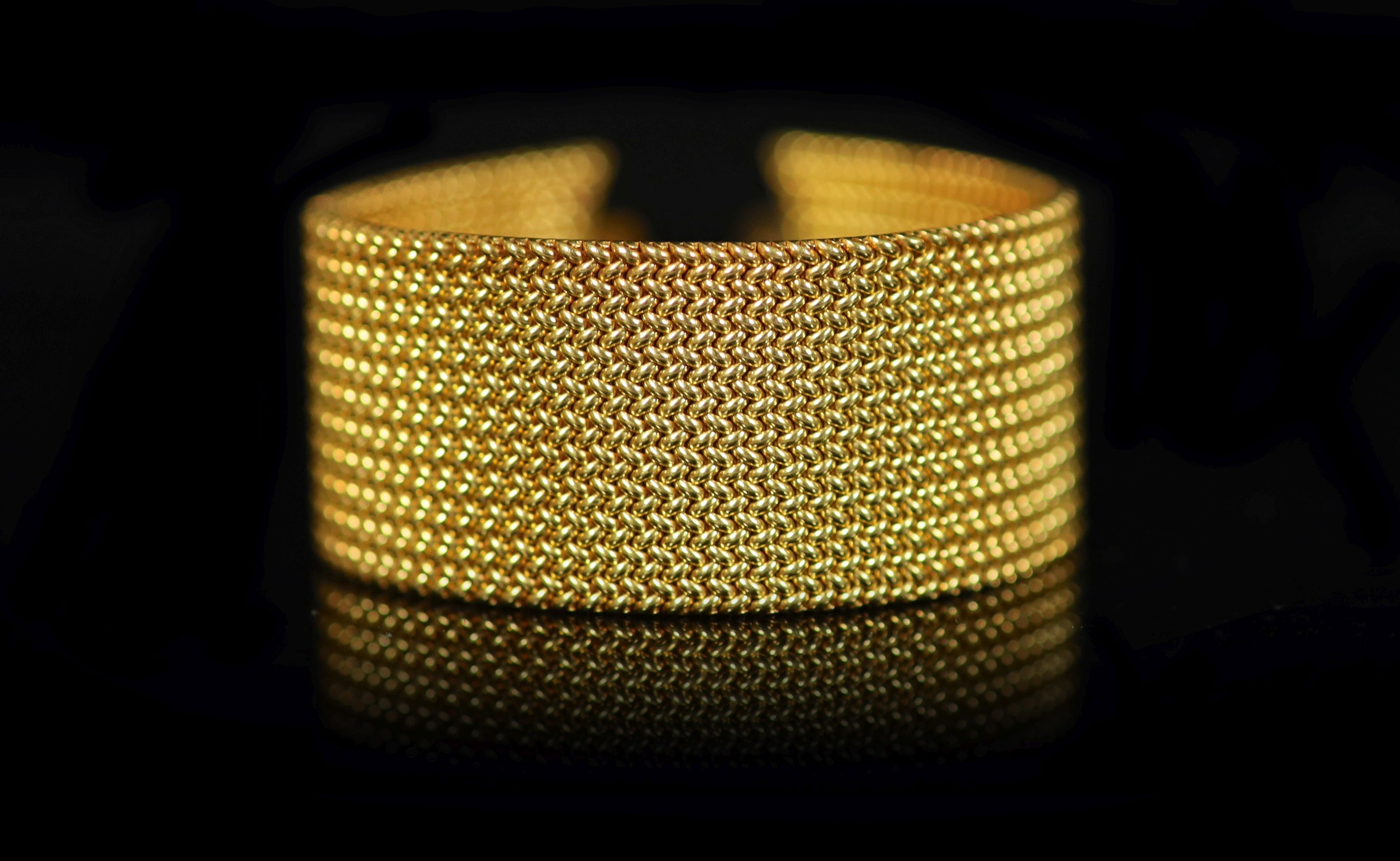 A Victorian gold mesh link bracelet section, lacking central motif